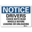 Notice: Drivers Chock Both Rear Wheels Before Loading Or Unloading Signs