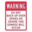 Warning: Do Not Back Up Over Spikes Or Severe Tire Damage Will Occur Signs image