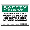Safety First: Wheels Chocks Must Be Placed On Both Sides Before Loading Signs image