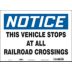 Notice: This Vehicle Stops At All Railroad Crossings Signs